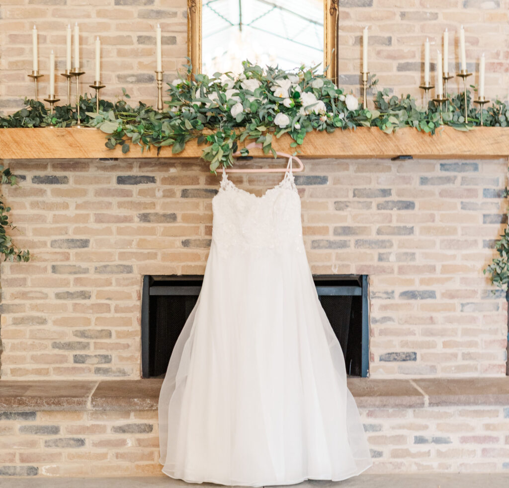 wedding dress on the fireplace mantle