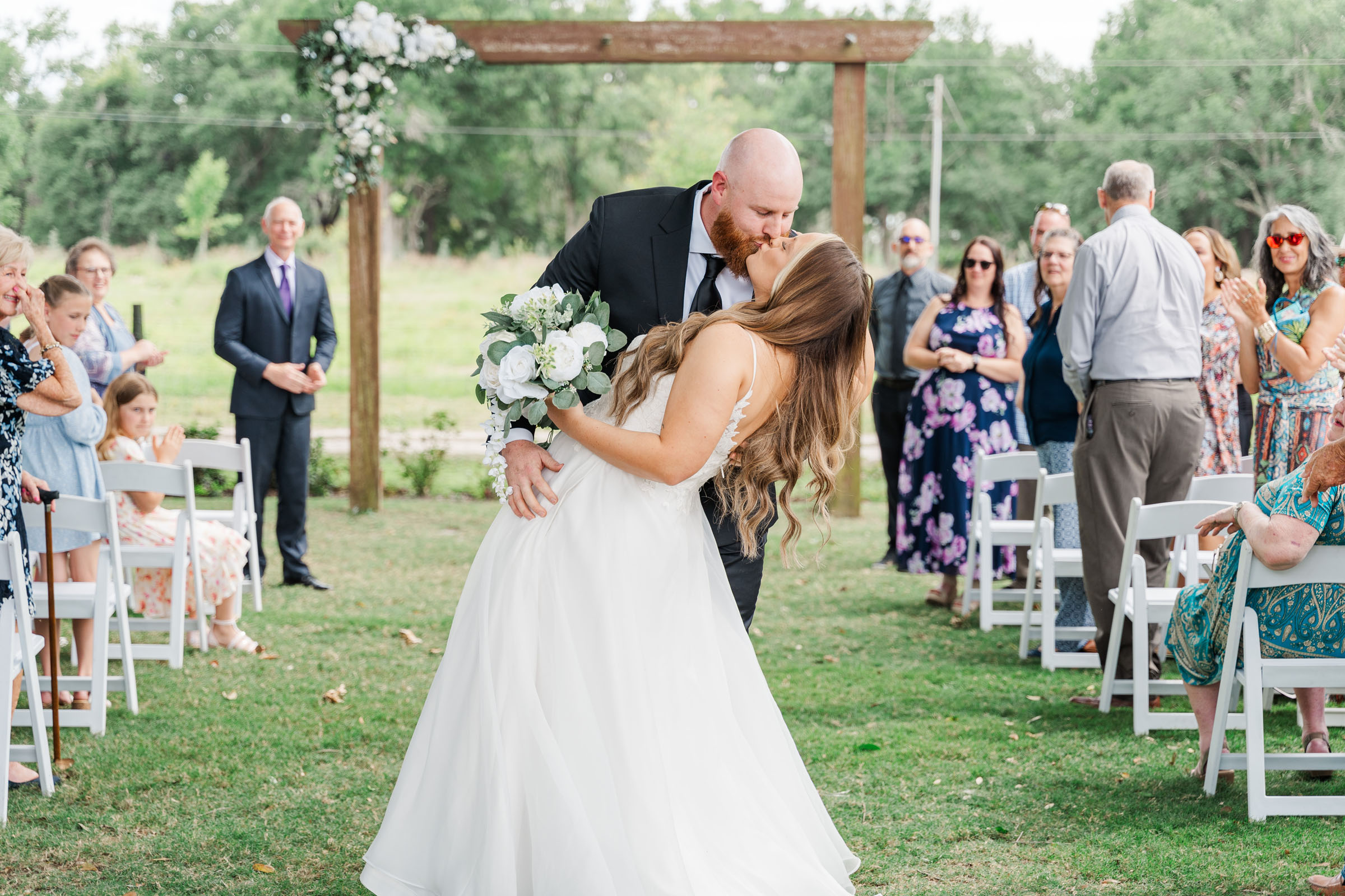 bride and grooms first kiss at ceremony