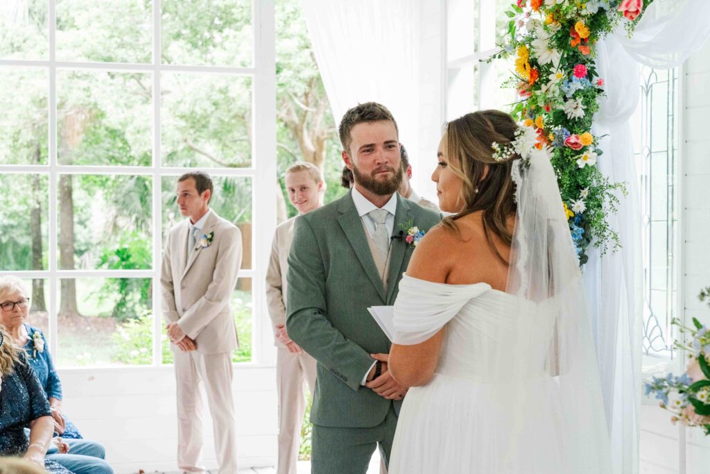 bride and groom at the alter