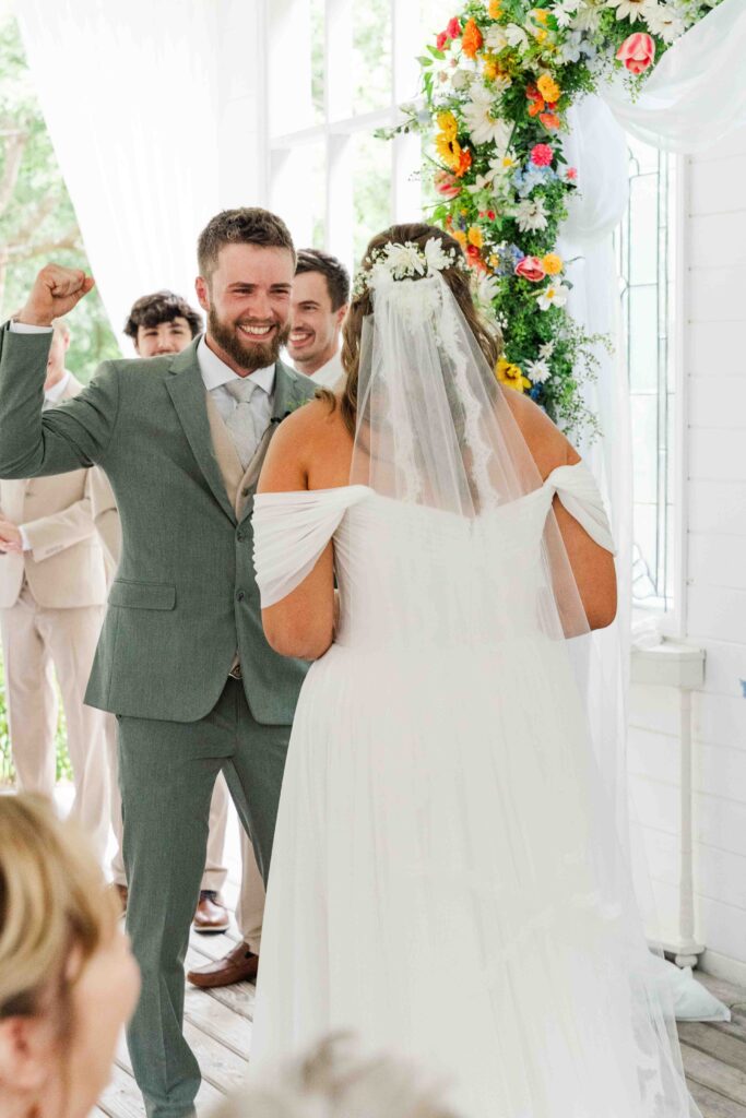 bride and groom at the alter