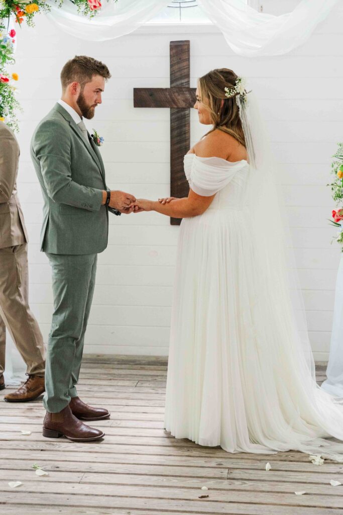 bride and groom at the alter