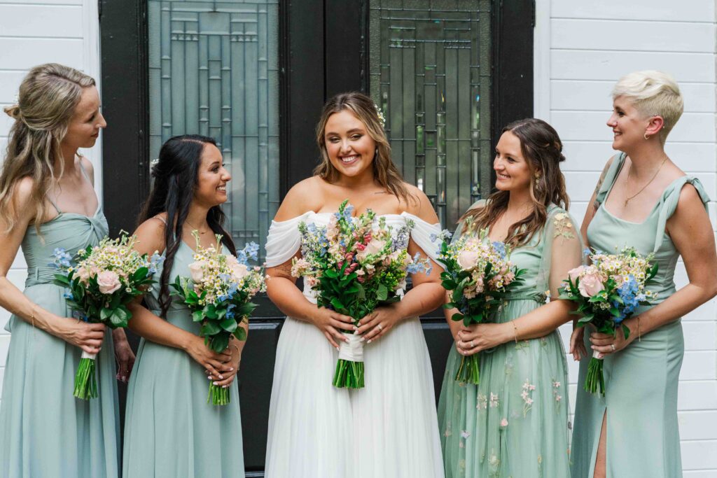 bride with her bridesmaids 