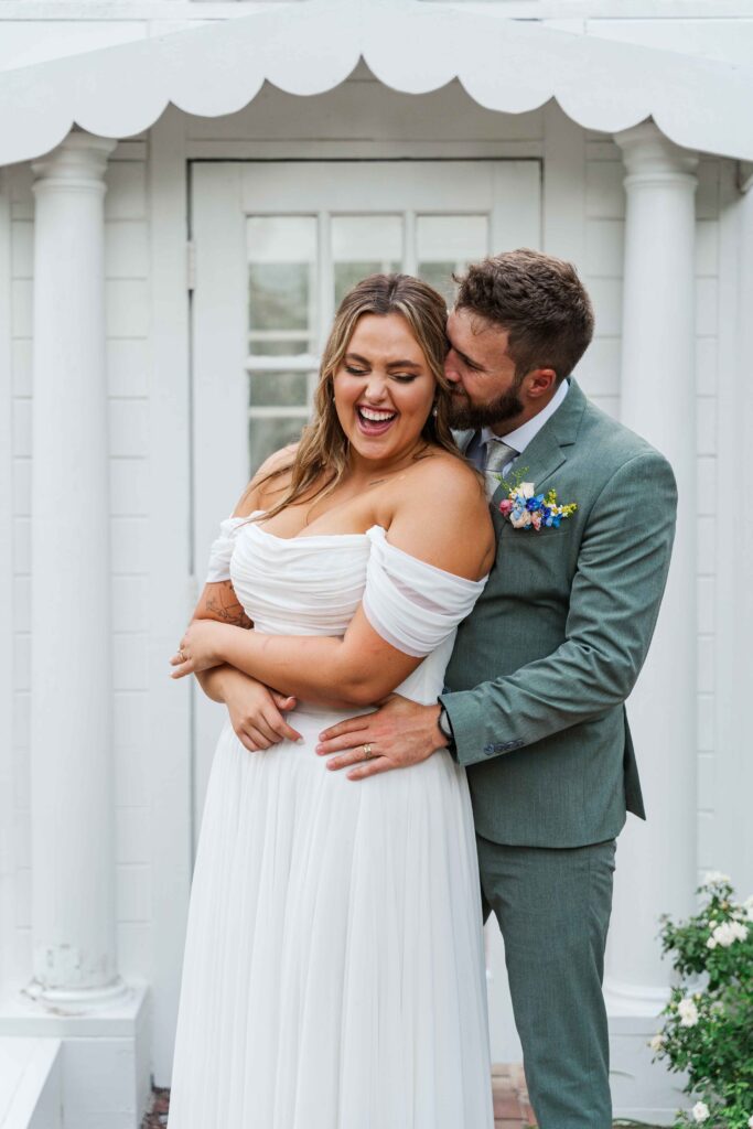 bride and groom cuddling just married 