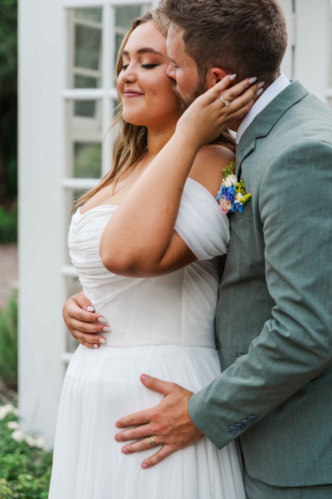 bride and groom cuddling just married 