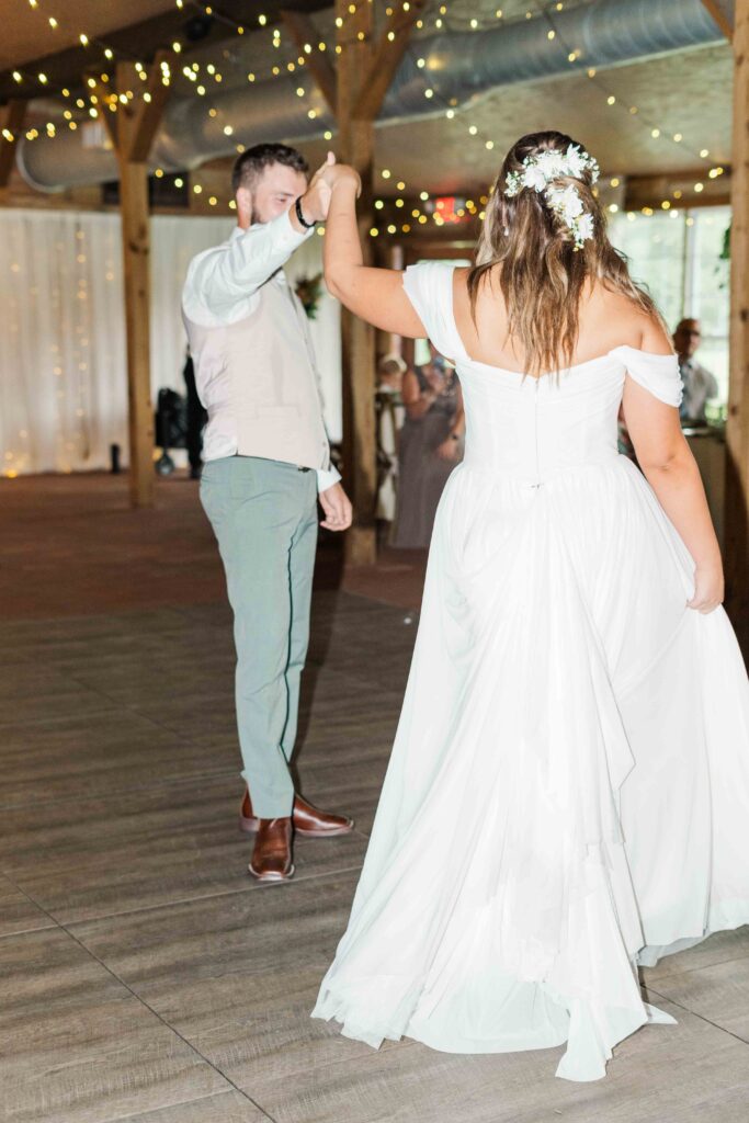 bride and groom dancing at reception 