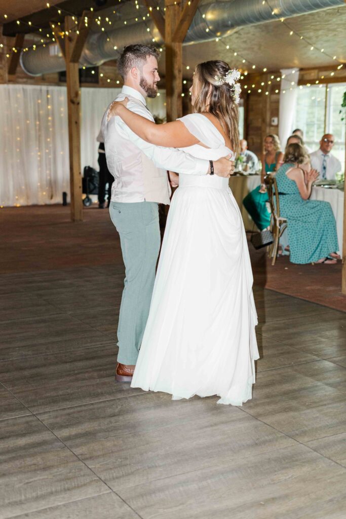 bride and groom dancing at reception 