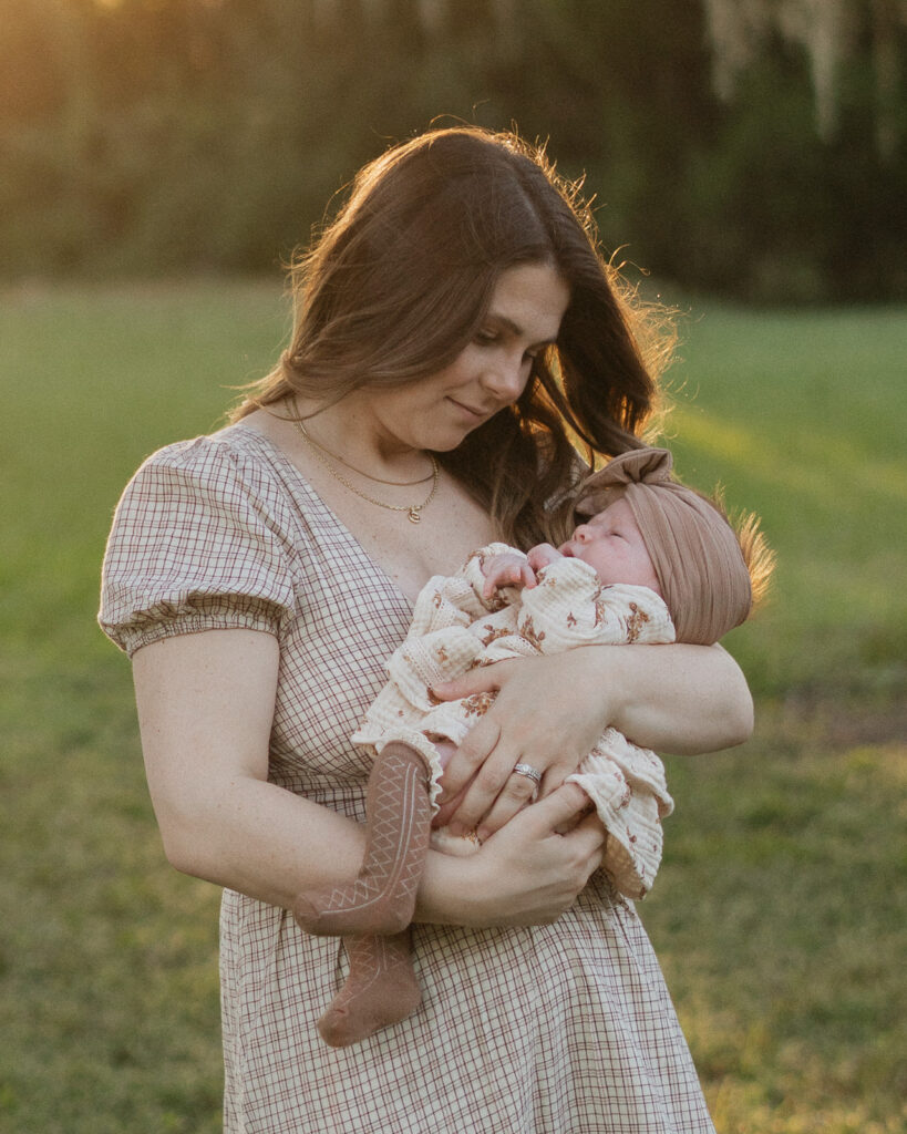 Lakeland family photographers mother holding newborn.jpg