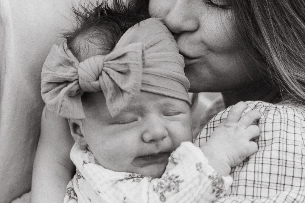Lakeland family photographers mother kissing baby.jpg