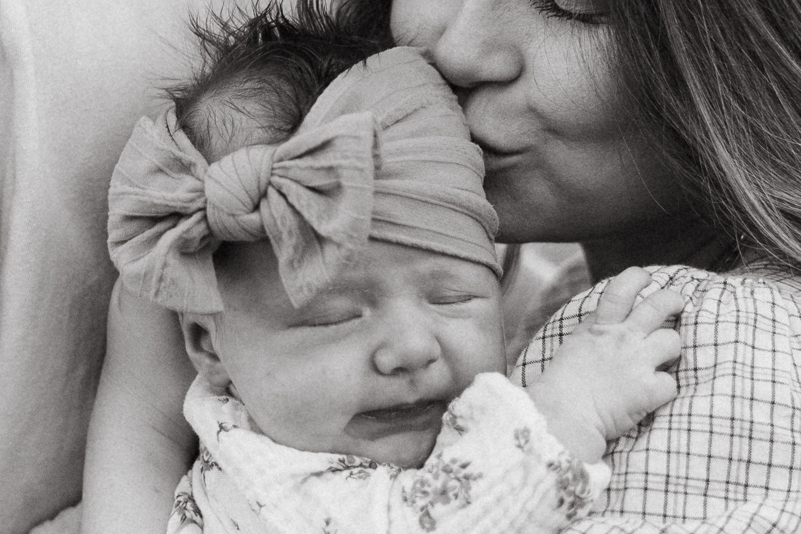 Lakeland family photographers mother kissing baby.jpg